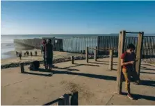  ?? NEW YORK TIMES FILE PHOTO ?? The border between the United States and Mexico extends into the Pacific Ocean in Tijuana.