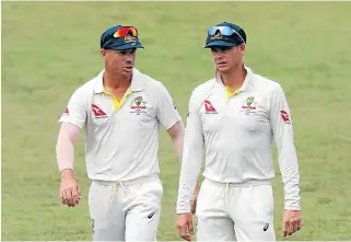  ?? /Reuters ?? Gentleman’s game: Australia’s David Warner, left, and Steve Smith during the first Test against SA in Durban, where the bowlers were reverseswi­nging an older ball.