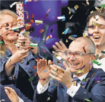  ?? MICHAEL SOHN, AP ?? Volker Beck, a gay rights activist in the Green Party, celebrates after the German parliament’s vote Friday.