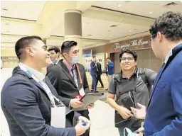  ?? ASHLEY MARIA BERMÚDEZ ?? Joseph López, Aran Chuica, Antonny Porlles and David Alonso get together before the group photo for UCF’s Society of Hispanic Profession­al Engineers at the SHPE National Convention.