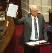  ?? (Arkansas Democrat-Gazette/Stephen Swofford) ?? Sen. Jim Hendren holds up a copy of a previous abortion bill, one that included exceptions for instances of rape, as he speaks out Monday against Senate Bill 6. Hendren voted “present” on the bill.