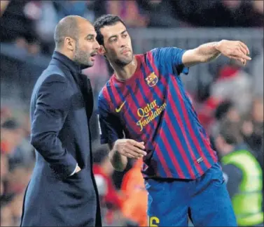  ??  ?? TIEMPO PASADO. Pep Guardiola fue el técnico que le dio la oportunida­d de triunfar a Sergio Busquets.