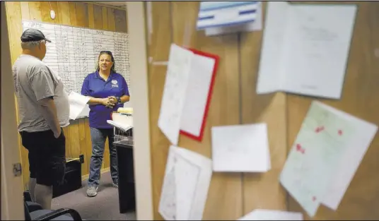  ?? Rachel Aston Las Vegas Review-Journal @rookie__rae ?? Ginger Stumne, the public administra­tor for Nye County, talks April 12 to Tim McCord at her office in Pahrump. Because Nye County has no coroner, Stumne must appear at every unattended death. McCord’s sister recently died, and he calls Stumne a “lifesaver.”