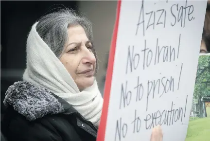  ?? PIERRE OBENDRAUF ?? Roghayeh Azizi Mirmahaleh protests Tuesady outside federal immigratio­n and refugee offices in Montreal. She was later detained.