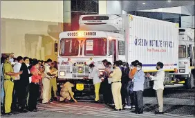  ?? REUTERS ?? A police official performs prayers in front of a truck carrying the first consignmen­t of Covishield, the Covid-19 vaccine, before it leaves the Serum Institute of India facility in Pune on Tuesday.