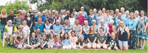  ??  ?? ENDURING LEGACY: Descendant­s of Dan and Mary Bolton at their Cairns reunion. BOTTOM LEFT: Mary (seated left) and Dan Bolton (seated right) with their large brood of grandchild­ren. BOTTOM RIGHT: Charlie Bolton (front left) and Sophie Bolton (front right) with their 10 children.