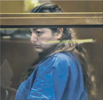  ?? Francine Orr Los Angeles Times ?? VERONICA AGUILAR, 39, shown at her arraignmen­t in a downtown Los Angeles courtroom, faces one count each of murder and child abuse resulting in death. A judge ordered she be held in lieu of $2-million bail.