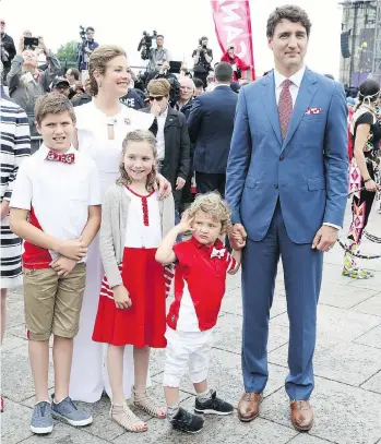  ?? PHOTO BY CHRIS JACKSON/GETTY IMAGES ?? Sophie Grégoire Trudeau and Justin Trudeau, with children, from left, Xavier, Ella-Grace and Hadrien, arrive for Canada Day celebratio­ns on Parliament Hill on Saturday in Ottawa.