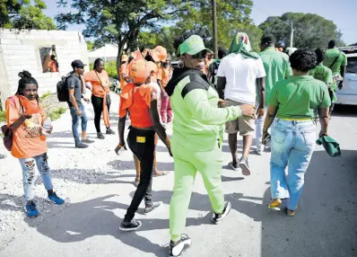  ?? RICARDO MAKYN/ MULTIMEDIA PHOTO EDITOR ?? Supporters of the PNP and JLP are seen at Yallahs Primary School in St Thomas on nomination day.