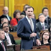  ?? THE CANADIAN PRESS FILES ?? Finance Minister Bill Morneau delivers the federal budget in the House of Commons on Parliament Hill in Ottawa on March 22. The Senate has given final approval to the federal government’s budget — but with amendments that would delete the so-called...