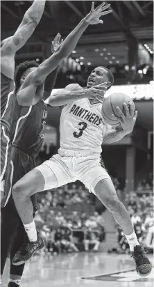  ?? Gregory Shamus / Getty Images ?? Gary Blackston (3) led Prairie View with 26 points, including a late 3-pointer that pulled the Panthers within 78-76 in the waning moments of Tuesday night’s game in Dayton, Ohio.