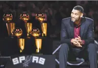  ?? Darren Abate / Associated Press ?? In this Dec. 18, 2016, file photo, San Antonio Spurs’ Tim Duncan listens while special guests speak about him during his jersey retirement ceremony in San Antonio. Joining Kobe Bryant as first-time finalists for the Basketball Hall of Fame are: 15-time All-Star Duncan, fellow 15-time All-Star Kevin Garnett and 10-time WNBA All-Star and four-time Olympic gold medalist Tamika Catchings.