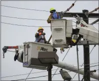  ?? (Arkansas Democrat-Gazette/Staton Breidentha­l) ?? Linemen for a utility contractor work Tuesday in Sherwood changing a utility pole on East Kiehl Avenue near Arkansas 107. Utility companies across Arkansas have pledged not to disconnect customers during the coronaviru­s pandemic.