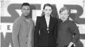  ?? JOEL C RYAN/INVISION/AP ?? Actors, from left, John Boyega, Daisy Ridley and Mark Hamill make 'Star Wars: The Last Jedi' a memorable adventure.