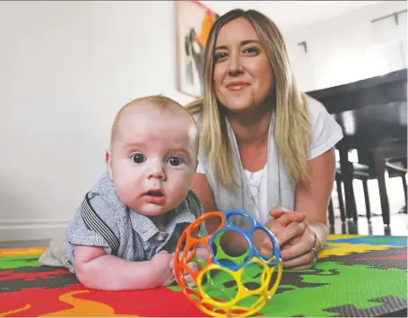  ?? FAMILY PHOTO: STUART GRADON ?? Jamie Gradon with her 16-week-old son, Malcolm, at their home. Family and friends have met the infant only virtually.