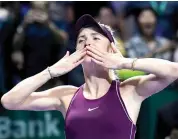 ?? — AFP ?? Ukraine’s Elina Svitolina celebrates her 3- 6, 6- 2, 6- 2 win over Sloane Stephens of the US in their singles final at the WTA Finals in Singapore on Sunday.