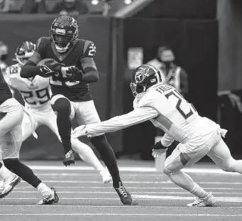  ?? Karen Warren / Staff photograph­er ?? Desmond King, left, offered some stability at cornerback late in the 2021 season, but there’s a good chance the Texans will be looking to upgrade the talent level at the position in the draft.