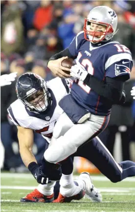  ?? | ELISE AMENDOLA/ AP ?? Texans linebacker Brian Cushing had one of two sacks of TomBrady last week. Brady was hit eight times and threw two intercepti­ons in the game.