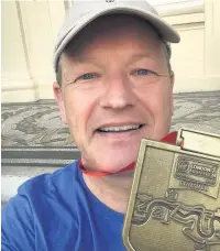  ??  ?? ●●Rochdale MP Simon Danczuk with his medal for completing the 2017 London Marathon