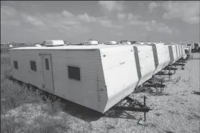  ?? RON T. ENNIS/FORT WORTH STAR-TELEGRAM FILE PHOTOGRAPH ?? FEMA trailers originally intended for use in New Orleans after the Katrina hurricane were on sale at McClain’s RV Superstore in south Fort Worth, Texas, July 14, 2010.