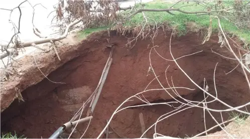  ?? Photo: Philip Shimnon Clement ?? A deep hole caused by erosion at Ladi Kwali street, Wuse Zone 4, Abuja