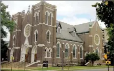  ?? Arkansas Democrat-Gazette/STEPHEN B. THORNTON ?? St. Edward Catholic Church in downtown Little Rock features many stained glass windows, common in Gothic Revival architectu­re.