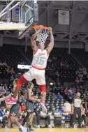  ?? COLE COOPER/TBT ?? The Enchantmen­t’s J.R. Giddens dunks in the first half en route to a team-high 17 points Saturday.