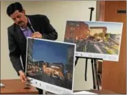  ?? MARK ROBARGE — MROBARGE@TROYRECORD.COM ?? Christiano Pereira of CPA Architectu­re shows to the Troy City Council during its Wednesday night Planning and Economic Developmen­t Committee meeting an artist’s rendition of a Bow Tie Cinema that would be built by Bonacio Constructi­on on the riverfront...