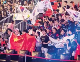  ?? ?? Fans cheer on Team China at the 2018 Asian Games in Jakarta, Indonesia, where esports debuted as a demonstrat­ion sport. At this year’s Hangzhou Games, esports will be an official medal sport.