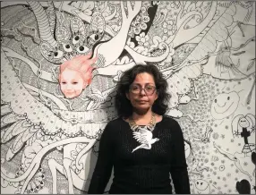  ?? (Special to the Democrat-Gazette) ?? Artist Kukuli Velarde poses with her work. “Kukuli Velarde: CORPUS,” 15 of her ceramic sculptures, each with a matching tapestry, go on display Monday at the University of Arkansas at Little Rock.