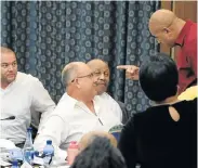  ?? Picture: BRIAN WITBOOI ?? FACING UP: Councillor­s Marlon Daniels (PA) and Athol Trollip (DA) during a confrontat­ion at the meeting