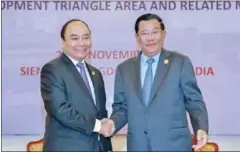  ?? SUPPLIED ?? Prime Minister Hun Sen and Vietnamese Prime Minister Nguyen Xuan Phuc shake hands during a meeting in Siem Reap last week.