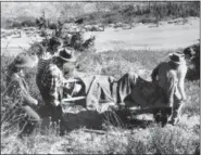  ?? THE ASSOCIATED PRESS ?? Volunteers from a nearby picnic area carry Supreme Court Justice William Douglas down a trail in the rugged Cascade Mountains near Yakima, Wash., after he was thrown from his horse. Justice Ruth Bader Ginsburg has missed a month of Supreme Court arguments as she recovers from lung cancer surgery. But she’s not the first justice to be away for a while and her absence hardly compares with those of some of her predecesso­rs. The day before the Supreme Court began its term in October 1949, Douglas broke 14 ribs and suffered a punctured lung when he was thrown from his horse. He didn’t return to the bench for nearly a half year, and his long recovery caused delays in several cases, including challenges to segregatio­n.