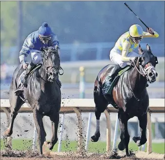  ?? [ASSOCIATED PRESS FILE PHOTO] ?? Classic Empire, right, with Julien Leparoux aboard, charges to the finish line to win the Breeders’ Cup Juvenile at Santa Anita on Nov. 5, 2016.