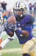  ??  ?? Wide receiver John Ross has 76 catches for 1,122 yards and 17 TDs this season for Pac-12 champion Washington. Associated Press file