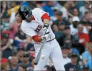  ?? MICHAEL DWYER — THE ASSOCIATED PRESS ?? Boston Red Sox’s J.D. Martinez hits a two-run home run during the fifth inning of a baseball game against the Baltimore Orioles in Boston, Sunday.