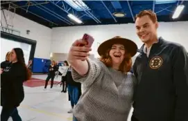  ?? PHOTOS BY CRAIG F. WALKER/GLOBE STAFF ?? Boston Bruins mascot Blades cheered with kids at the Boys & Girls Clubs of Dorchester Marr Clubhouse (left) while Jane Richard (above) took a selfie with Tuukka Rask during an event Saturday to announce funds for a new field house.