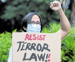  ?? — GRIG C. MONTEGRAND­E ?? CONTINUING OBJECTION A total of 37 petitions are questionin­g the constituti­onality of the Anti-terrorism Act at the Supreme Court, their resistance embodied by one of the protesters who gathered for a rally on the University of the Philippine­s Diliman campus on July 7.