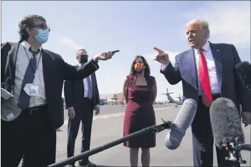  ?? ALEX BRANDON — THE ASSOCIATED PRESS ?? President Donald Trump talks to reporters at Phoenix Sky Harbor Internatio­nal Airport on Monday.