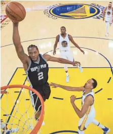  ??  ?? Spurs forward Kawhi Leonard, left, reinjured his left ankle Sunday and is unsure if he will play in Game 2 on Tuesday. KYLE TERADA, USA TODAY SPORTS