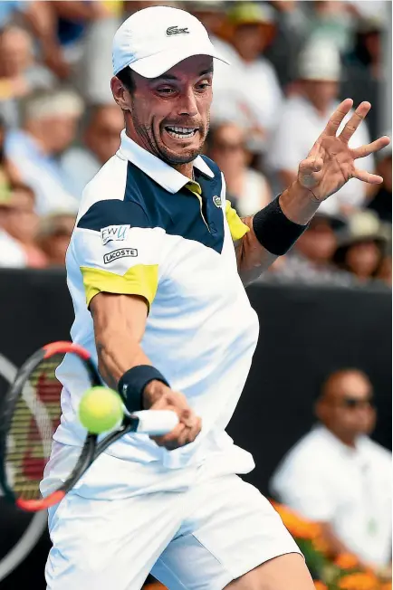  ?? PHOTOSPORT ?? Spain’s Roberto Bautista Agut hammers a forehand against Juan Martin del Potro in his 6-1 4-6 7-5 final win yesterday.