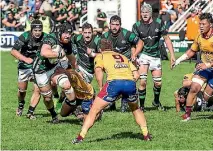  ?? PHOTO: DOUG FIELD/STUFF ?? South Canterbury captain Kieran Coll charges towards North Otago halfback Robbie Smith in the Heartland Championsh­ip.