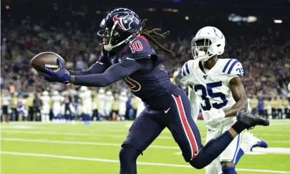  ?? Photograph: Wesley Hitt/Getty Images ?? DeAndre Hopkins of the Houston Texans catches a pass for a touchdown during the second half of Thursday’s game.