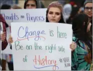  ?? ERIC BONZAR—THE MORNING JOURNAL ?? Lorain High School junior Katelynn Peters, 17, stands outside with her fellow classmates as they came together in solidarity to remember the victims of the Marjory Stoneman Douglas High School shooting, in Parkland Fla., during National School Walkout...