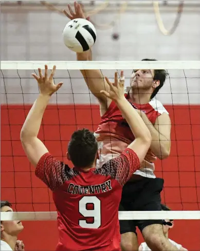  ?? File photo by Jerry Silberman / risportsph­oto.com ?? No. 5 East Providence will have a size advantage on No. 1 Mount St. Charles in tomorrow night’s Division I semifinal, but the Mounties possess one of the top middles in the state in senior Mike DelliCarpi­ni (above, hitting).
