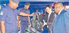  ?? Picture: JOVESA NAISUA ?? Defence Minister Inia Seruiratu and Japanese ambassador to Fiji Kawakami Fumihiro inspect the maritime safety and security equipment yesterday.