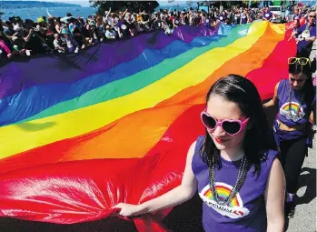  ?? PHOTOS: NICK PROCAYLO ?? The Vancouver Pride Parade drew a large crowd to the West End route, from Robson Street and down along Beach Avenue. Sunday’s 40th anniversar­y parade featured more than 170 floats.