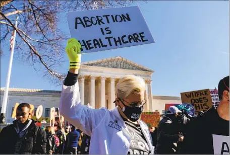  ?? Andrew Harnik Associated Press ?? ABORTION RIGHTS advocates and antiaborti­on demonstrat­ors gather in front of the Supreme Court in Washington last week as the justices hear arguments in a case involving a Mississipp­i law on abortion. The state law bans the procedure after 15 weeks of pregnancy.