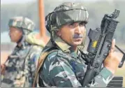  ?? AFP PHOTO ?? CRPF jawans stand guard after a gunfight with militants at Hajin village in Kashmir's Bandipora district on Wednesday.