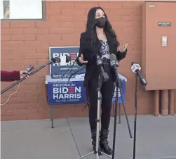  ??  ?? Cher speaks Monday in support of former Vice President Joe Biden. Cher spoke outside an early voting location at Fowler Elementary School in Phoenix.